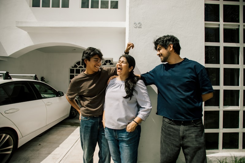 Family standing with their car